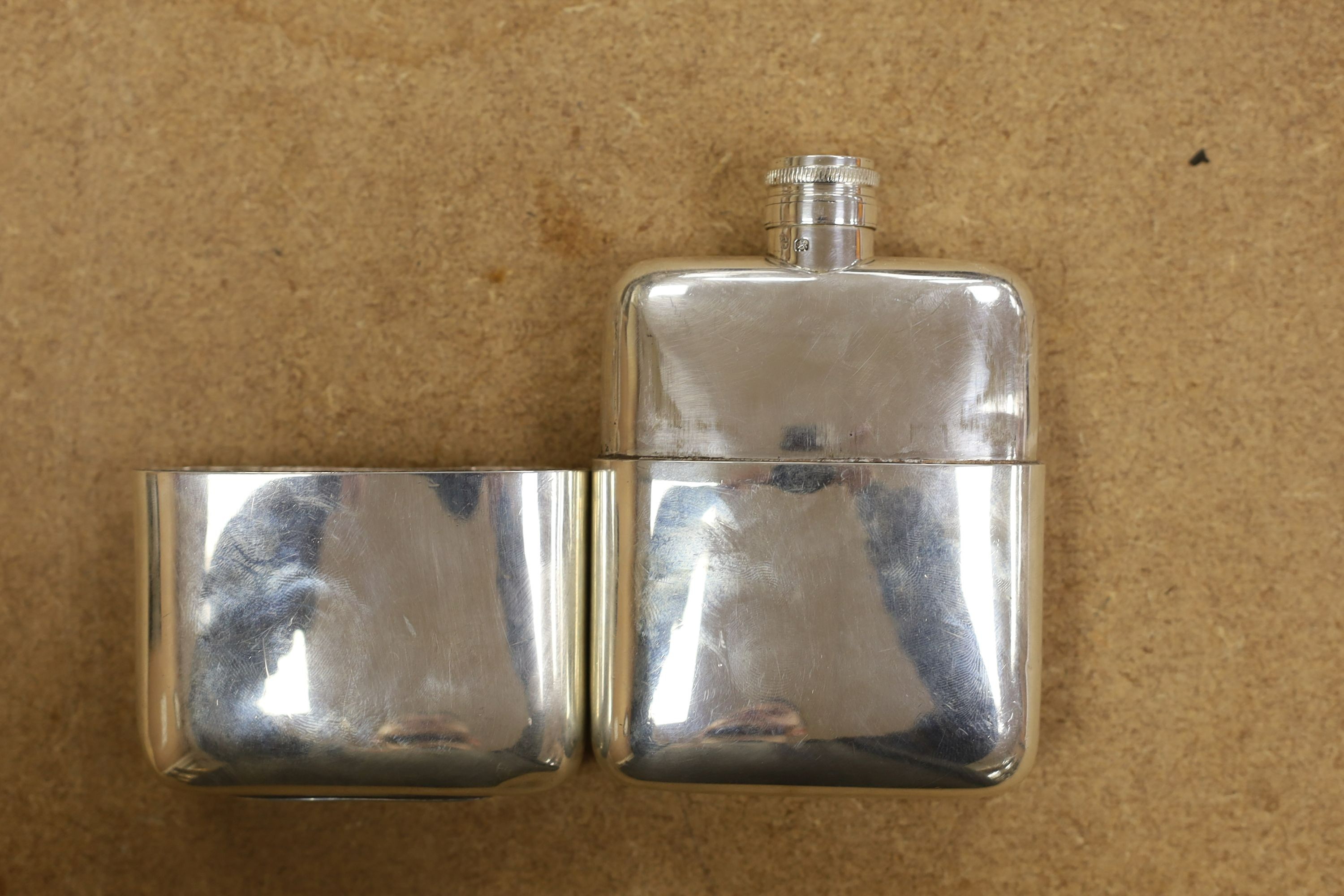 A George V silver hip flask, by Goldsmiths & Silversmiths Co Ltd, London, 1918/19, 13cm, 9oz.